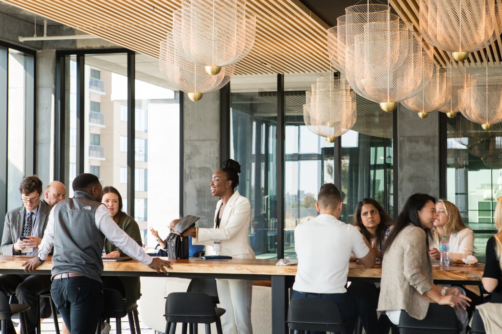 Event attendees connect during a networking lunch.