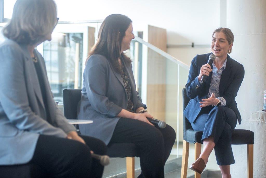 IC Hub Director Chelsea Schiller speaks with panelists during a side event at BIO International Convention in Boston, Massachusetts.